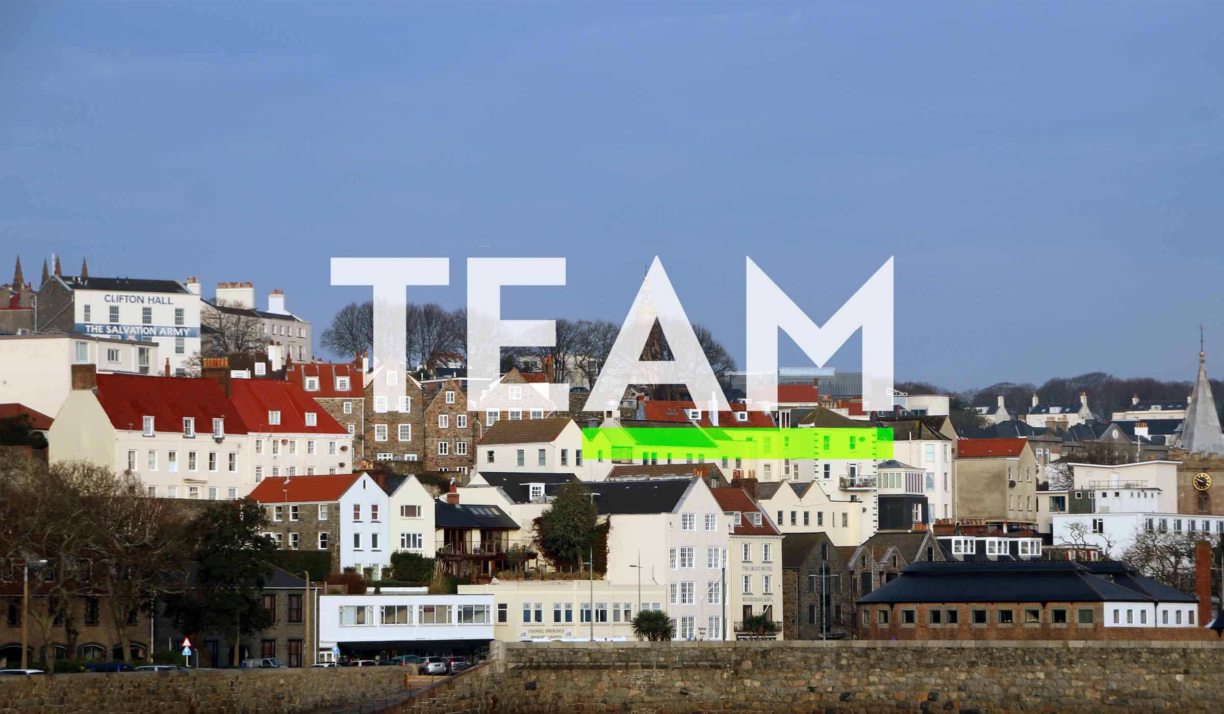 Guernsey harbour front with the TEAM logo