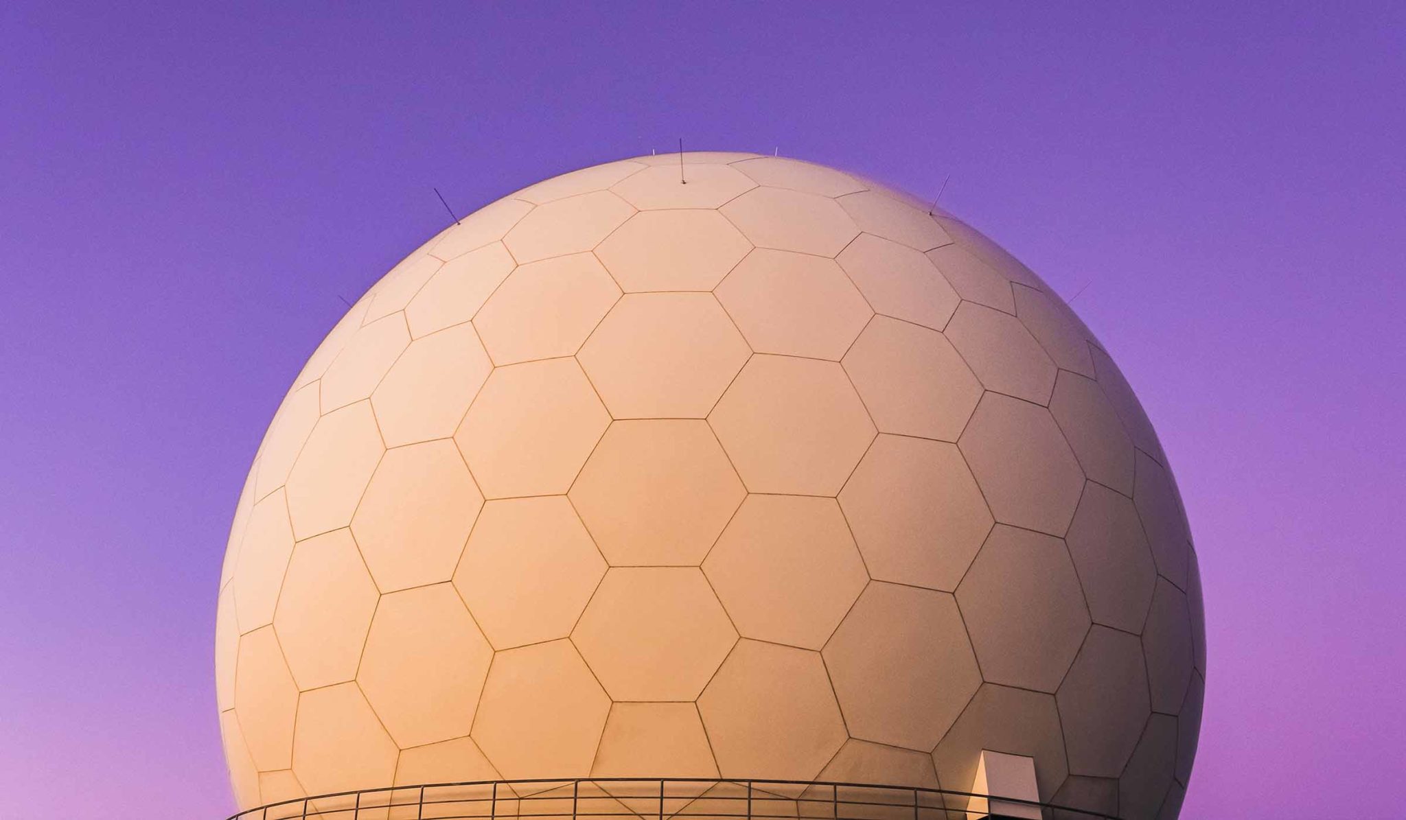 Radar dome against a purple sky