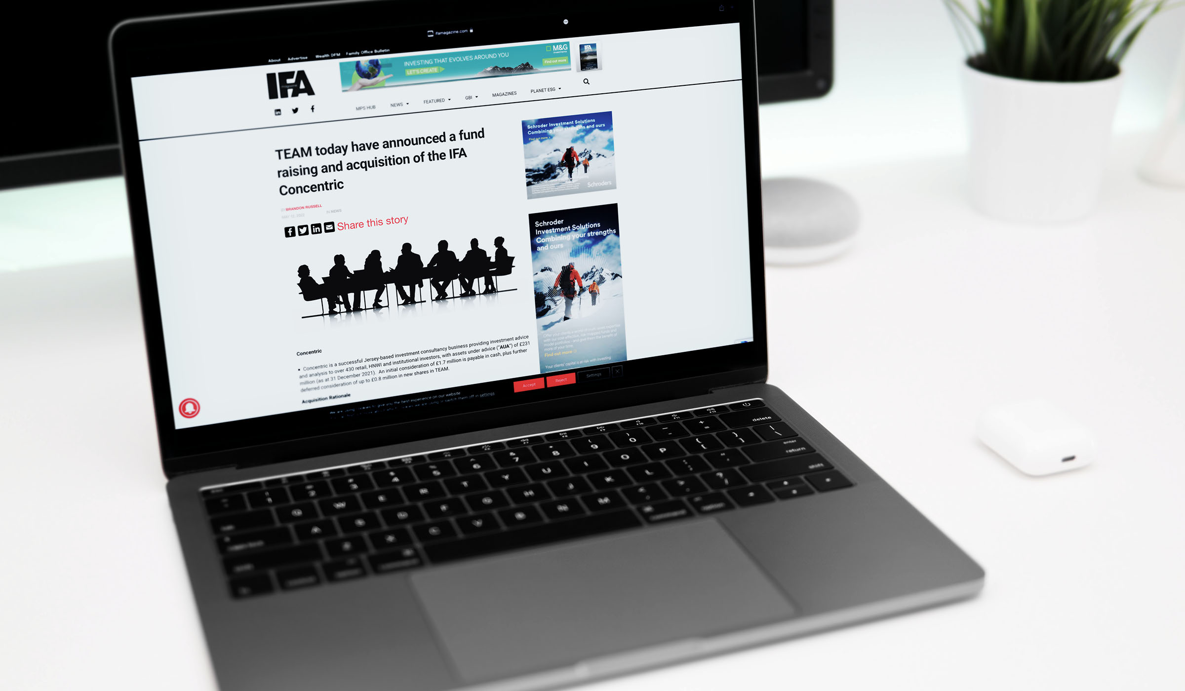 Laptop showing IFA Magazine coverage of TEAM's fundraising and acquisition of Concentric