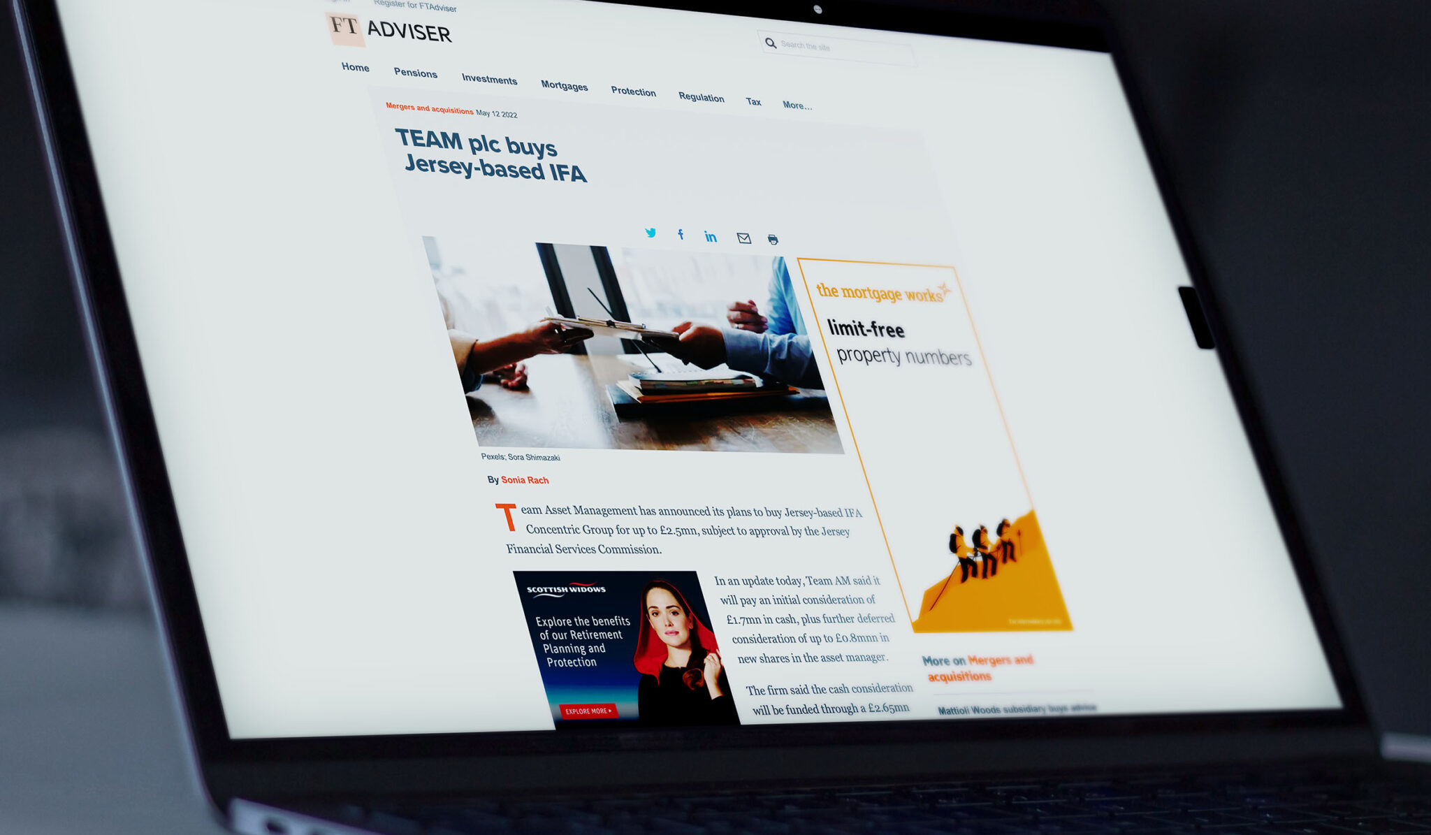 Laptop showing International Adviser coverage of TEAM Asset Management buying a Jersey investment consultancy