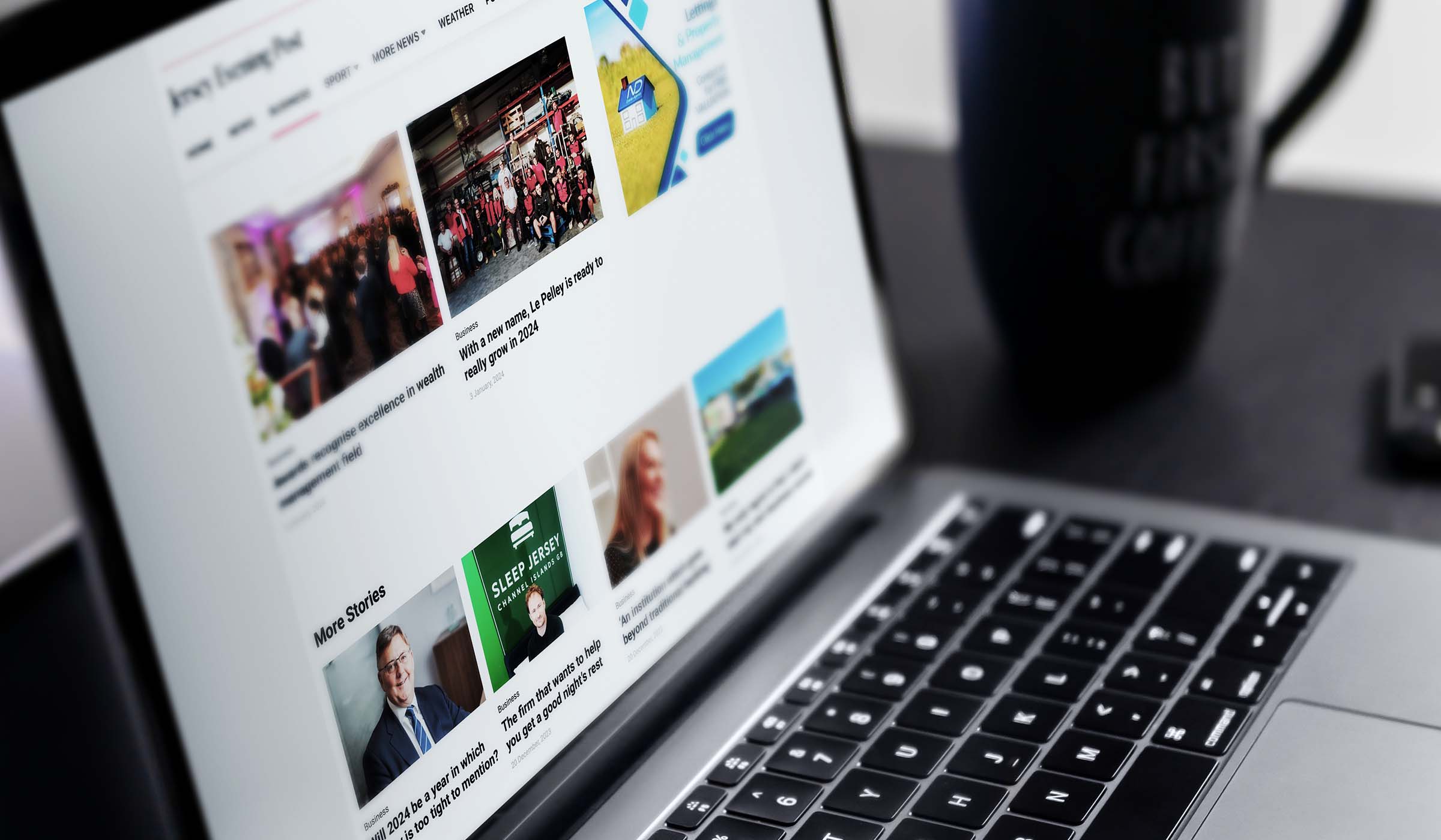 Laptop showing Jersey Evening Post coverage of TEAM buying a financial planning firm
