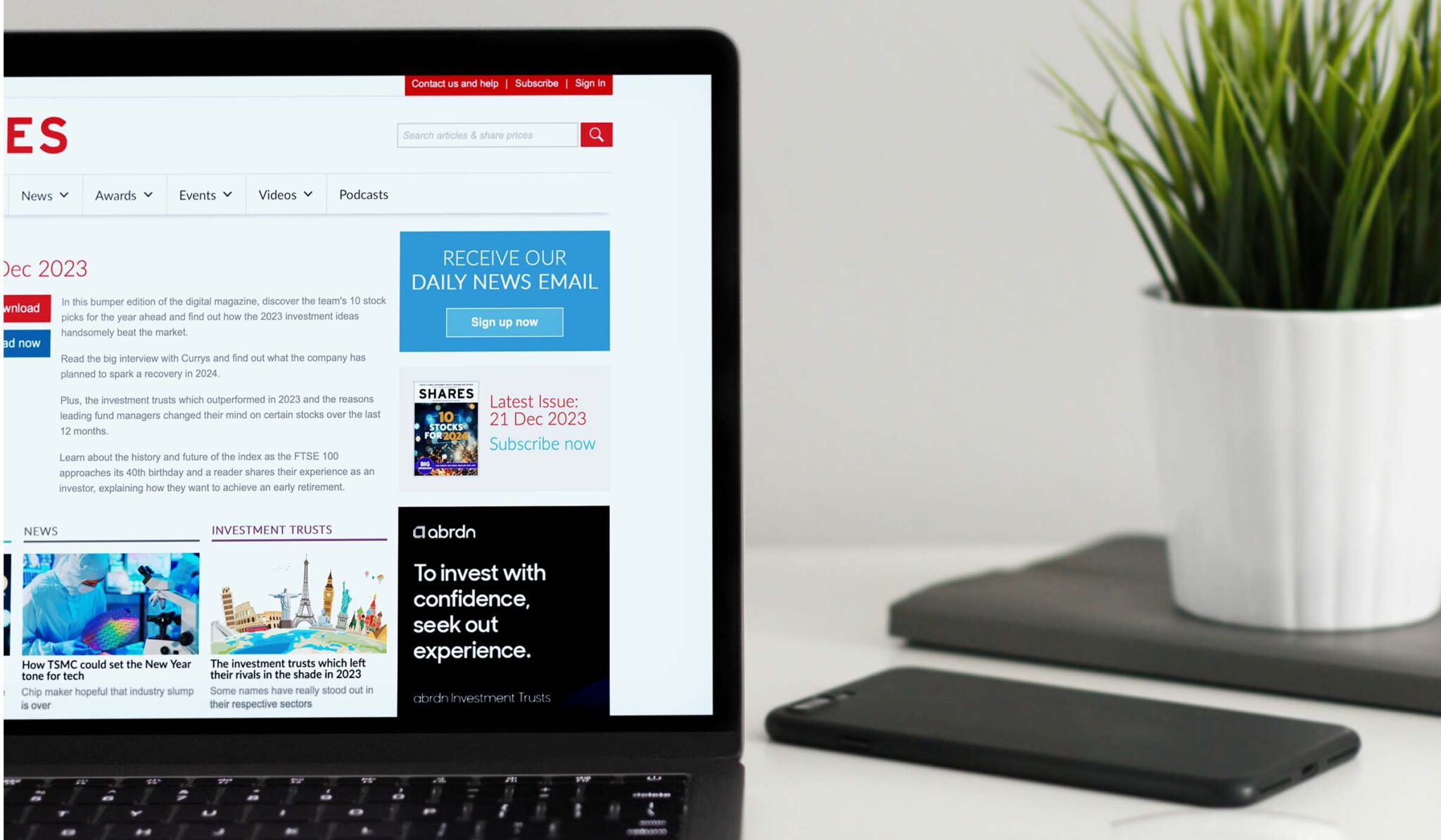 Laptop showing Shares magazine coverage of TEAM exchanging contracts on Homebuyer for £2.4 million