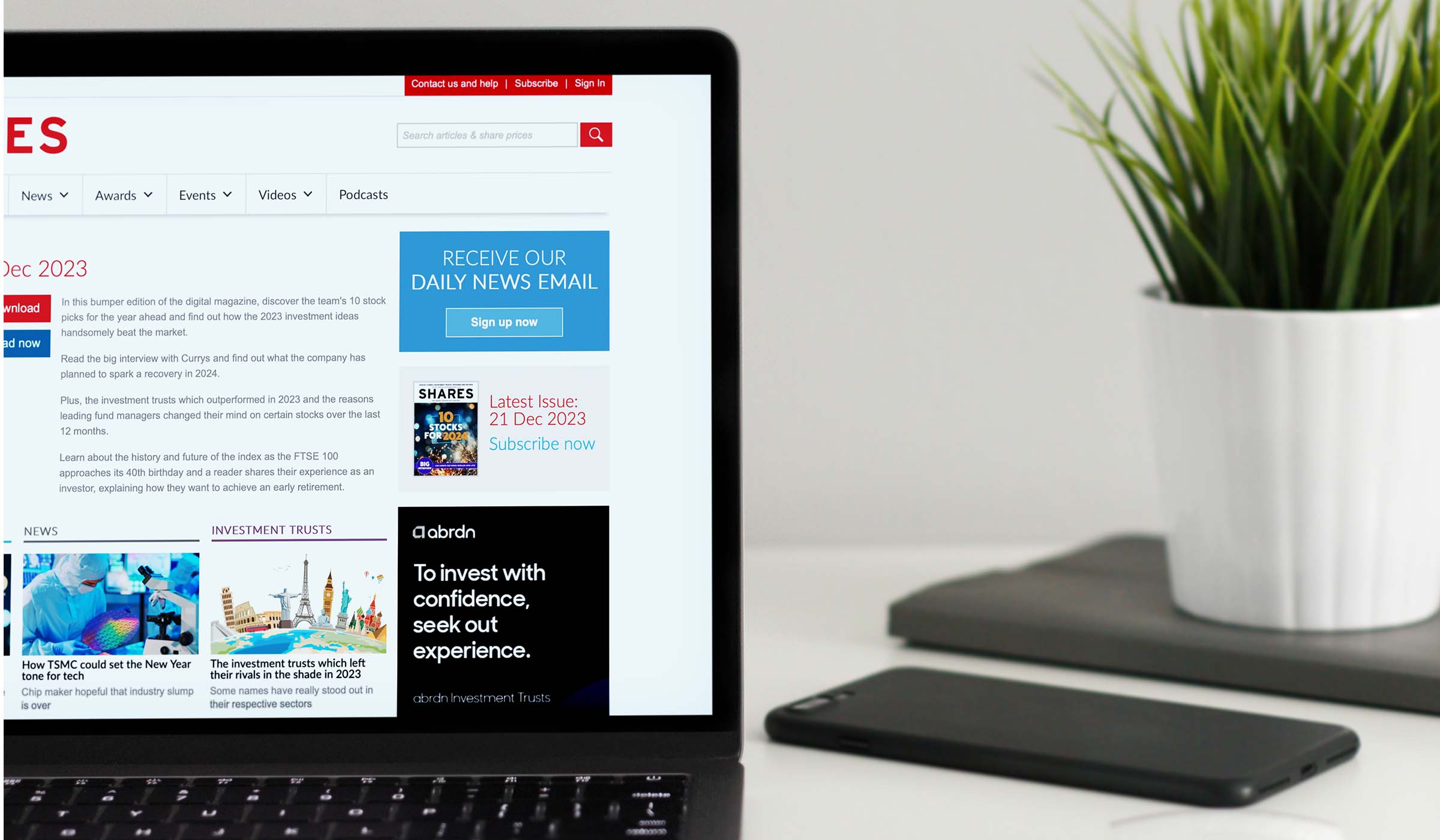 Laptop showing Shares magazine coverage of TEAM exchanging contracts on Homebuyer for £2.4 million