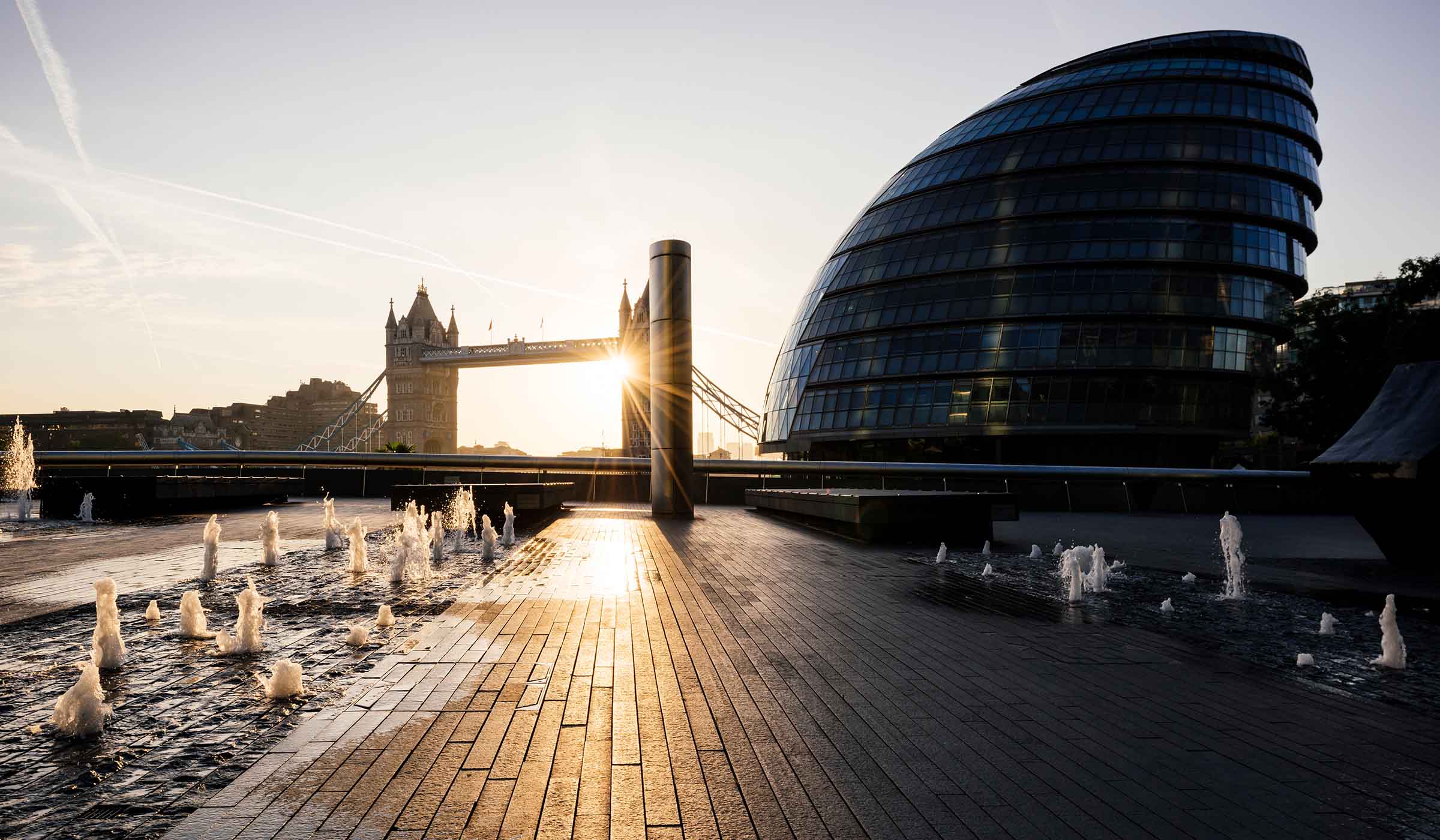 Tower Bridge and the River Thames in London at sunrise